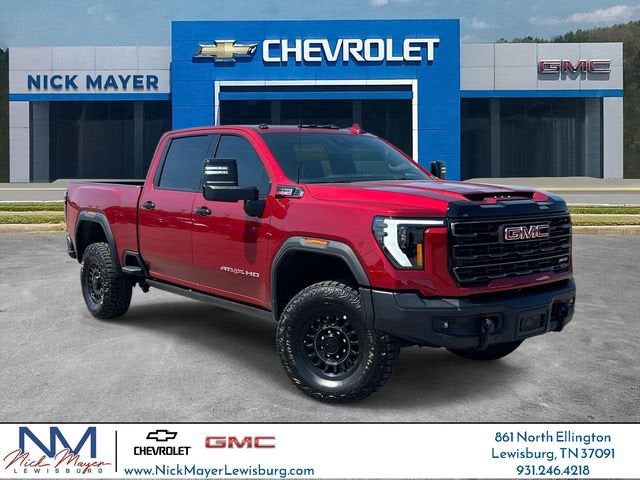 2026 GMC Sierra 2500 HD AT4X in Volcanic Red Tintcoat — front three-quarter view